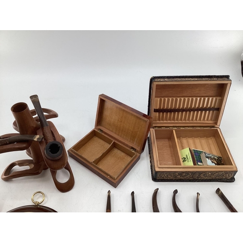 186 - A collection of miscellaneous items to include a collection of vintage pipes, boxes, paper knives, w... 