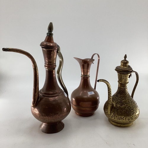 188 - A collection of metalware to include Middle Eastern style ewers, trench art and other items