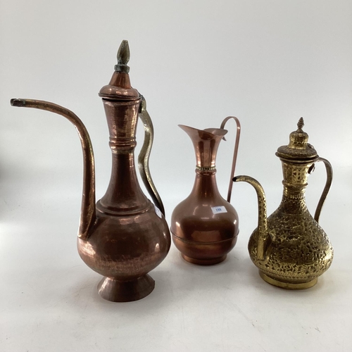 188 - A collection of metalware to include Middle Eastern style ewers, trench art and other items