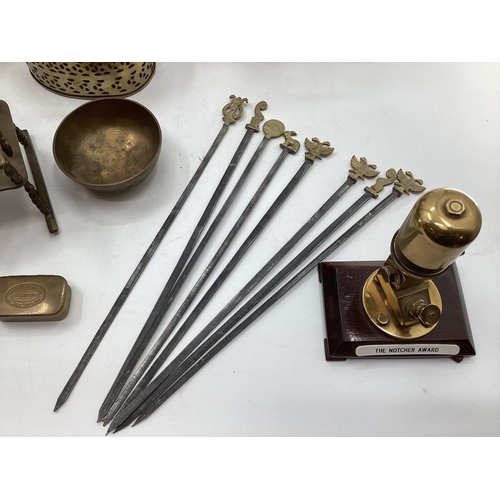 188 - A collection of metalware to include Middle Eastern style ewers, trench art and other items