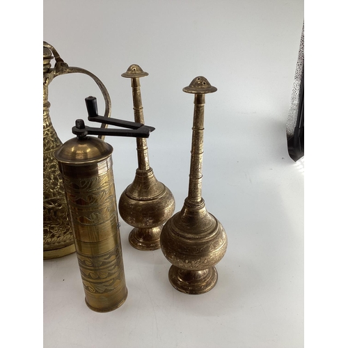 188 - A collection of metalware to include Middle Eastern style ewers, trench art and other items