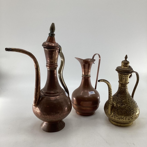 188 - A collection of metalware to include Middle Eastern style ewers, trench art and other items