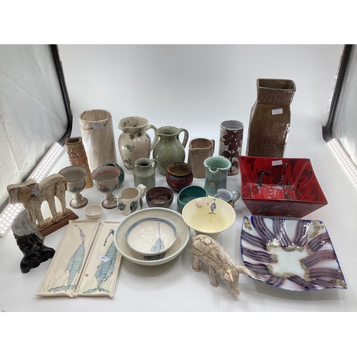 189 - A collection of studio pottery together with carved marble items to include Bernard Rouke