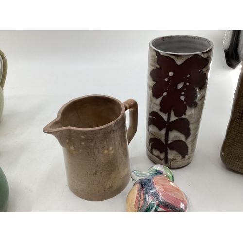 189 - A collection of studio pottery together with carved marble items to include Bernard Rouke