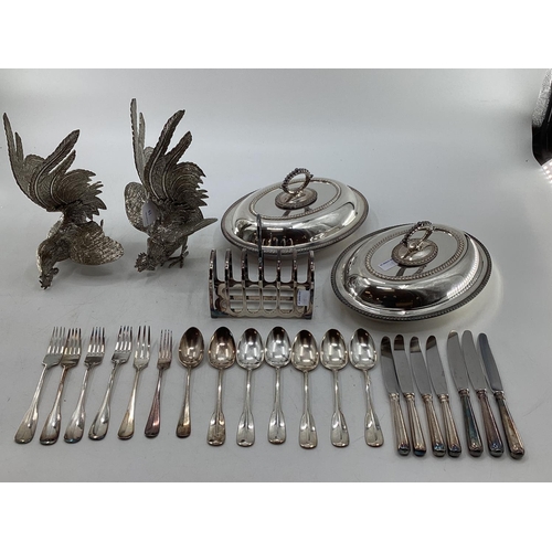 19 - A matched pair of silver plated table ornaments each 28cmH, and other silver plated wares, birds, fl... 