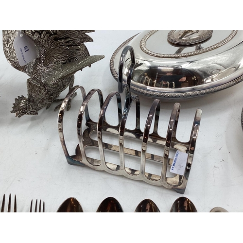 19 - A matched pair of silver plated table ornaments each 28cmH, and other silver plated wares, birds, fl... 