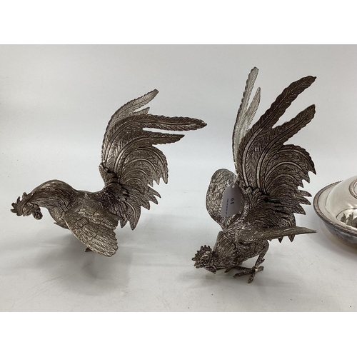 19 - A matched pair of silver plated table ornaments each 28cmH, and other silver plated wares, birds, fl... 