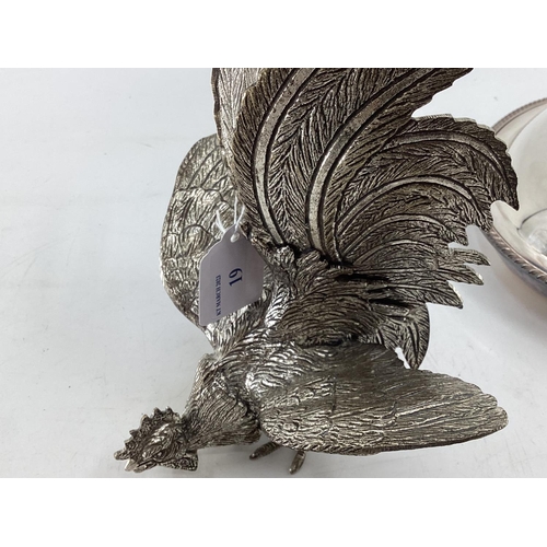 19 - A matched pair of silver plated table ornaments each 28cmH, and other silver plated wares, birds, fl... 