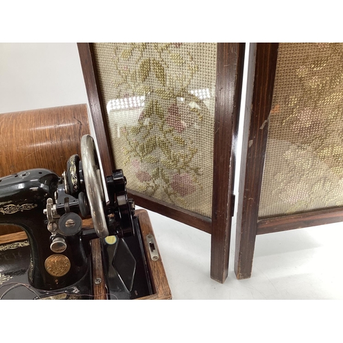 199 - AN oak framed hexagonal mirror, bevelled glass plate, together with a small embroidered screen and a... 