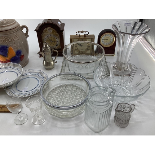 200 - A miscellaneous collecting of items to include glassware, a rumtopf lidded jar, mantle clocks and ot... 