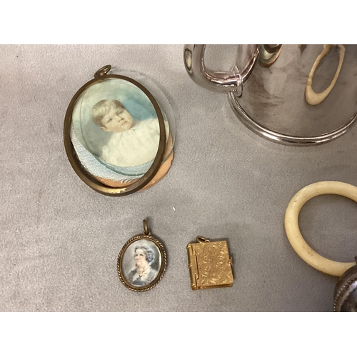 22 - A collection of unmarked white metal and silver plated items to include nutcracker, teething ring, 2... 