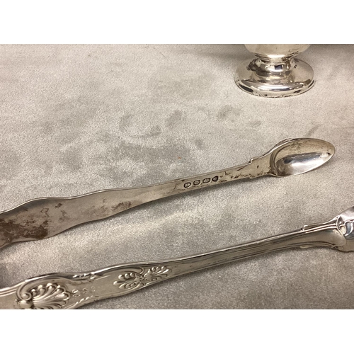 23 - A collection of sterling silver items to include Georgian letter openers, pepperette, cream jug, sug... 