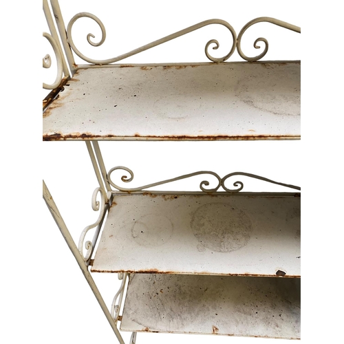 438 - Vintage style rustic and slightly rusty narrow metal shelving unit, with scrolling iron work design ... 