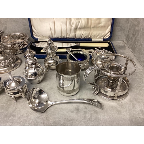 46 - A collection of silver plated items, candlesticks, pierced dish etc