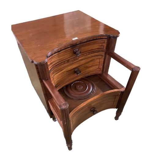 428 - A large Regency  mahogany inverted bow front commode with reeded columns and turned raised legs to c... 