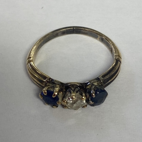 58 - A sapphire and diamond ring in unmarked yellow metal central old diamond, with round cut sapphire ac... 