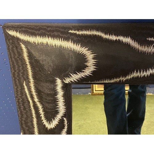 415 - A decorative rectangular wall mirror, framed in a faux  chenille brown and cream animal skin border