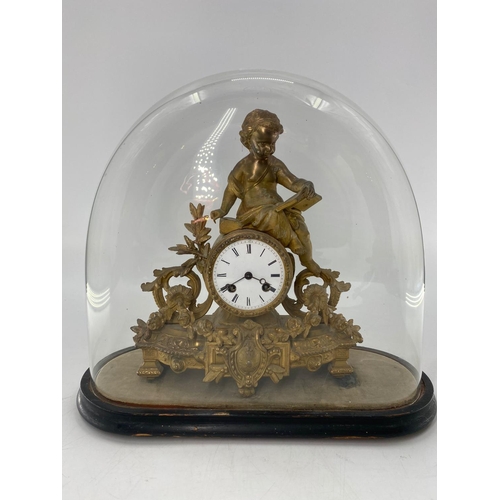 209 - A French Japy Frere gilt mantle clock, surmounted by Cherub figure reading a book, in a glass dome. ... 