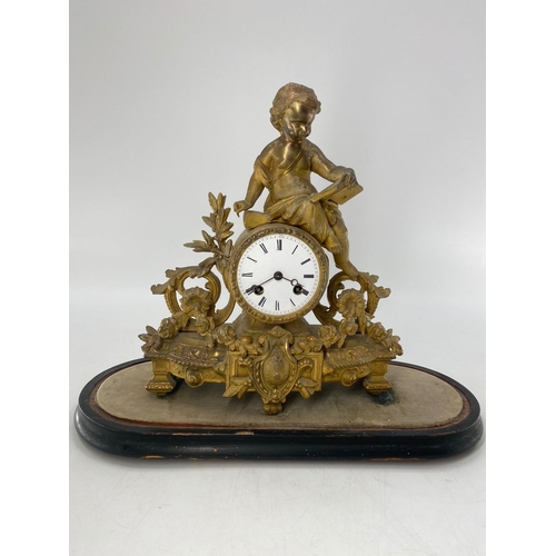 209 - A French Japy Frere gilt mantle clock, surmounted by Cherub figure reading a book, in a glass dome. ... 