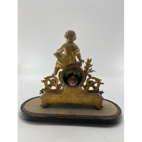 209 - A French Japy Frere gilt mantle clock, surmounted by Cherub figure reading a book, in a glass dome. ... 