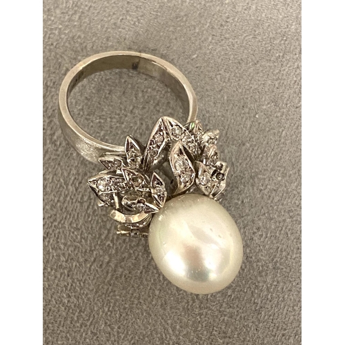 35 - A modern and impressive pearl and diamond ring, size O