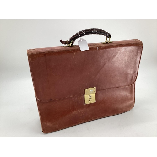 257 - A vintage tan leather attache or brief case, 43 x 37cm