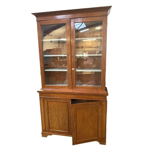 625 - A two-section mahogany bookcase, the upper section with two glazed panelled doors,  and a pair of cu... 