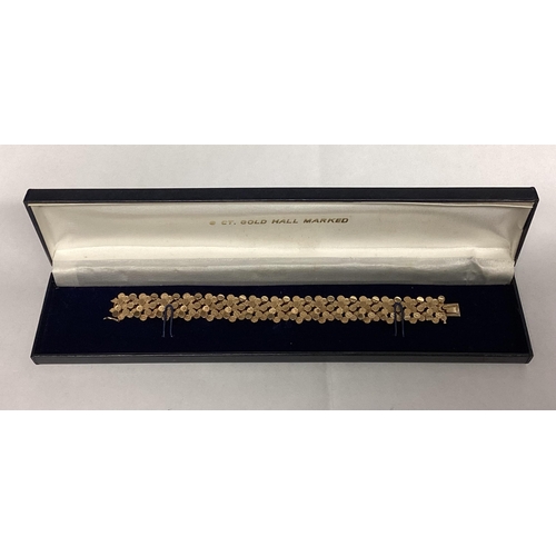 1 - A 9ct gold bracelet of pierced circular textured design. 18cm. 29g.