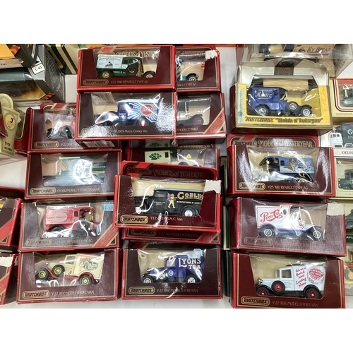 102 - Collection of boxed tin plate toy cars to include Matchbox, Dinky, Vanguard and other makers