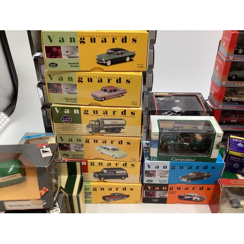 102 - Collection of boxed tin plate toy cars to include Matchbox, Dinky, Vanguard and other makers