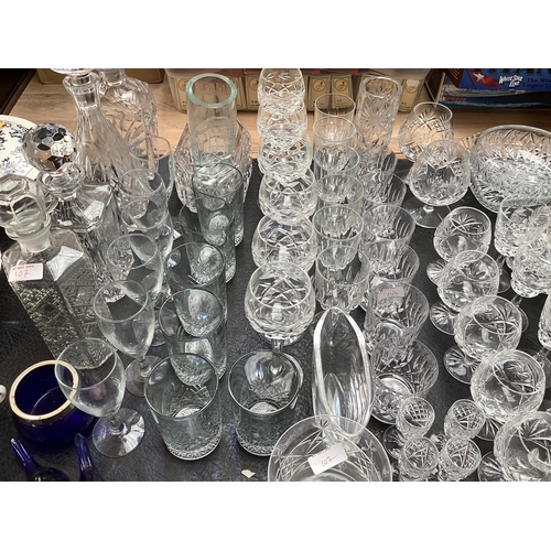 107 - A large collection of crystal glassware to include bowls brandy balloons hock glass and other items