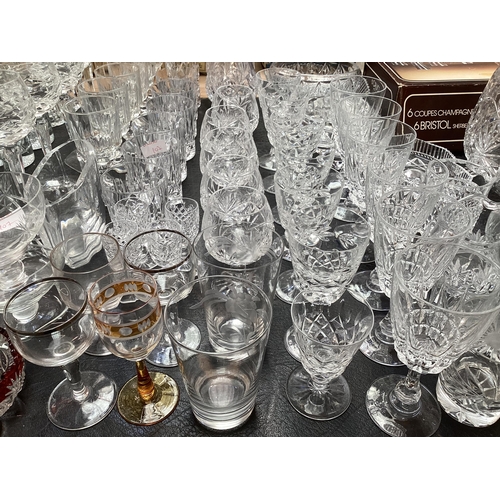 107 - A large collection of crystal glassware to include bowls brandy balloons hock glass and other items