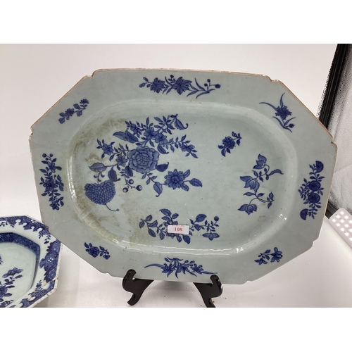 108 - Four blue and white serving dishes together with a porcelain circular tray with gilt handles, larges... 