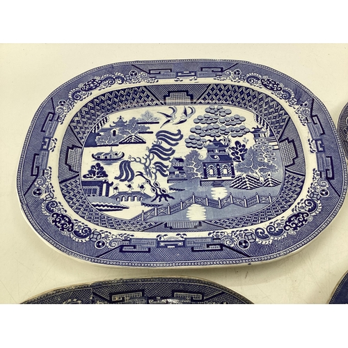 110 - Four ceramic Willow Pattern serving dishes, largest 43cm x 35cm (some wear etc, see images)