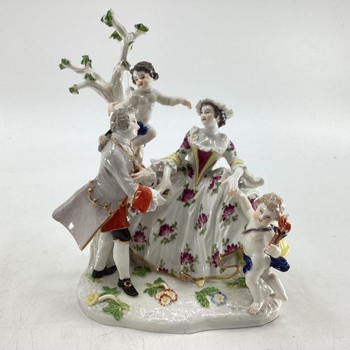 114 - Two Meissen style figural groups, blue crossed sword mark to base.  Largest is 19cm H (some wear and... 