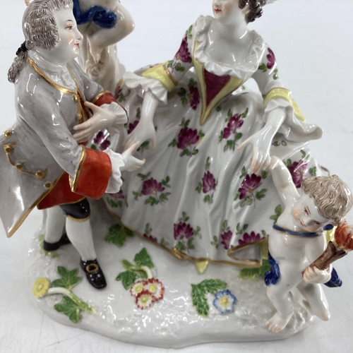 114 - Two Meissen style figural groups, blue crossed sword mark to base.  Largest is 19cm H (some wear and... 