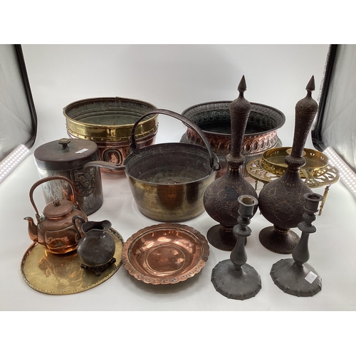 128 - Collection of metalware to include a Victorian copper planter a large brass and copper planter a pai... 