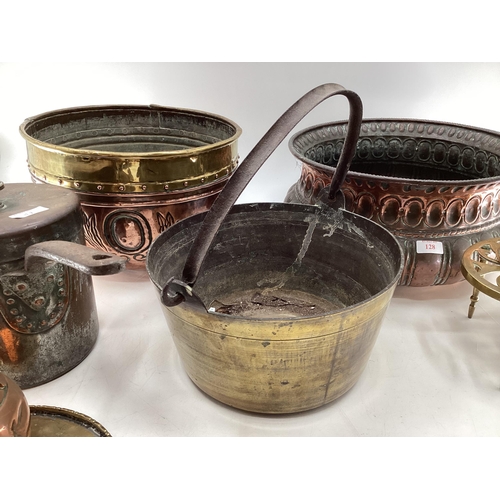 128 - Collection of metalware to include a Victorian copper planter a large brass and copper planter a pai... 