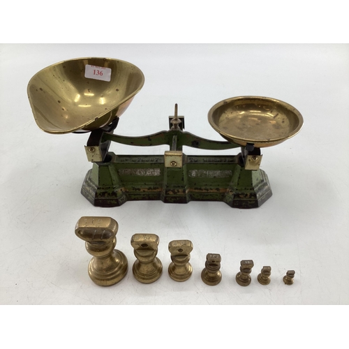 136 - A set of metal scales, brass pans and weights, 30cm W  not tested