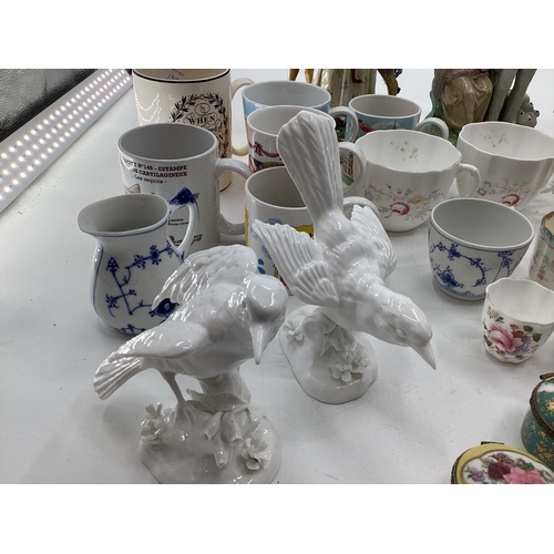 137 - A mixed collection of ceramics and glassware to include Staffordshire figures, Blanc de Chine, Birds... 