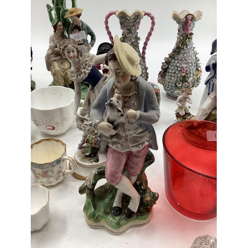 137 - A mixed collection of ceramics and glassware to include Staffordshire figures, Blanc de Chine, Birds... 