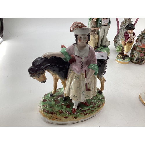 137 - A mixed collection of ceramics and glassware to include Staffordshire figures, Blanc de Chine, Birds... 