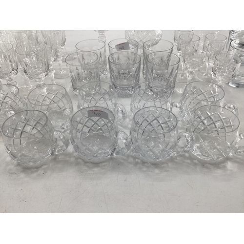 140 - A collection of crystal glassware to include brandy balloons, tumblers etc