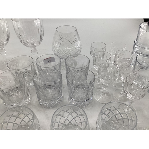 140 - A collection of crystal glassware to include brandy balloons, tumblers etc