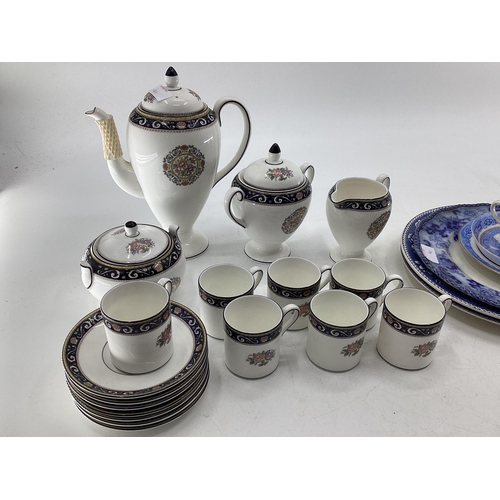 141 - A collection of mixed ceramics to include a Wedgwood Runneymede coffee set, and a collection of blue... 