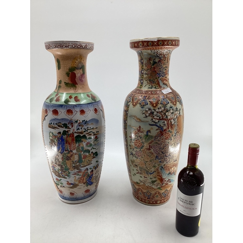 142 - Two large oriental style baluster vases each with floral and gilt  decoration, each 61cm