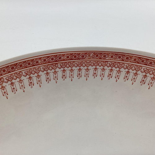 144 - A large presentation Oriental porcelain bowl decorated with stylised dragon, red character marks to ... 