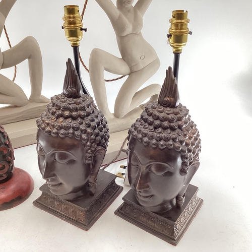 146 - Three pairs of table lamps of South East Asian style, to include a pair of cast metal Buddha heads, ... 