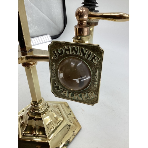 148 - An Edwardian brass free standing three bottle spirit dispenser by Gaskell and chambers, optic pearl ... 