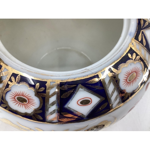 152 - A Royal Crown Derby Style Imari pattern tea pot, with silver plated loop handle, cross sword mark to... 